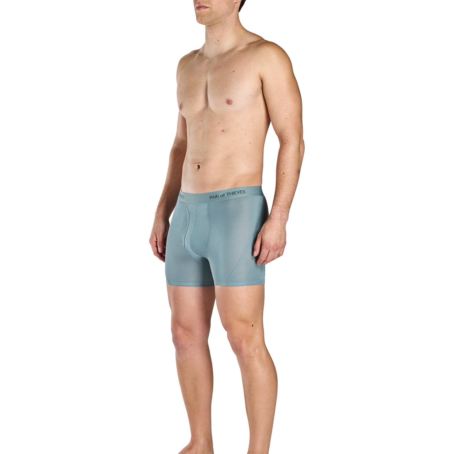 Man wearing light blue boxer briefs on a white background