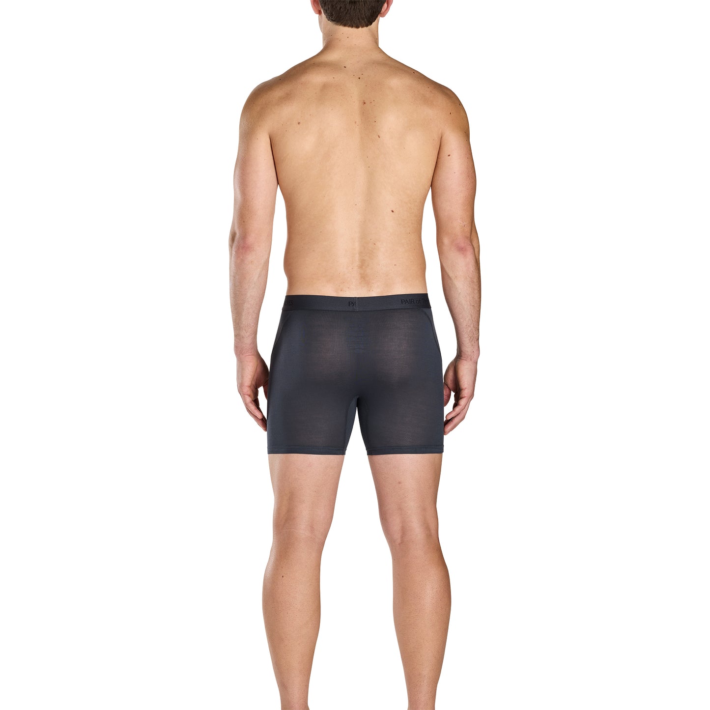 Man wearing black boxer briefs on a white background