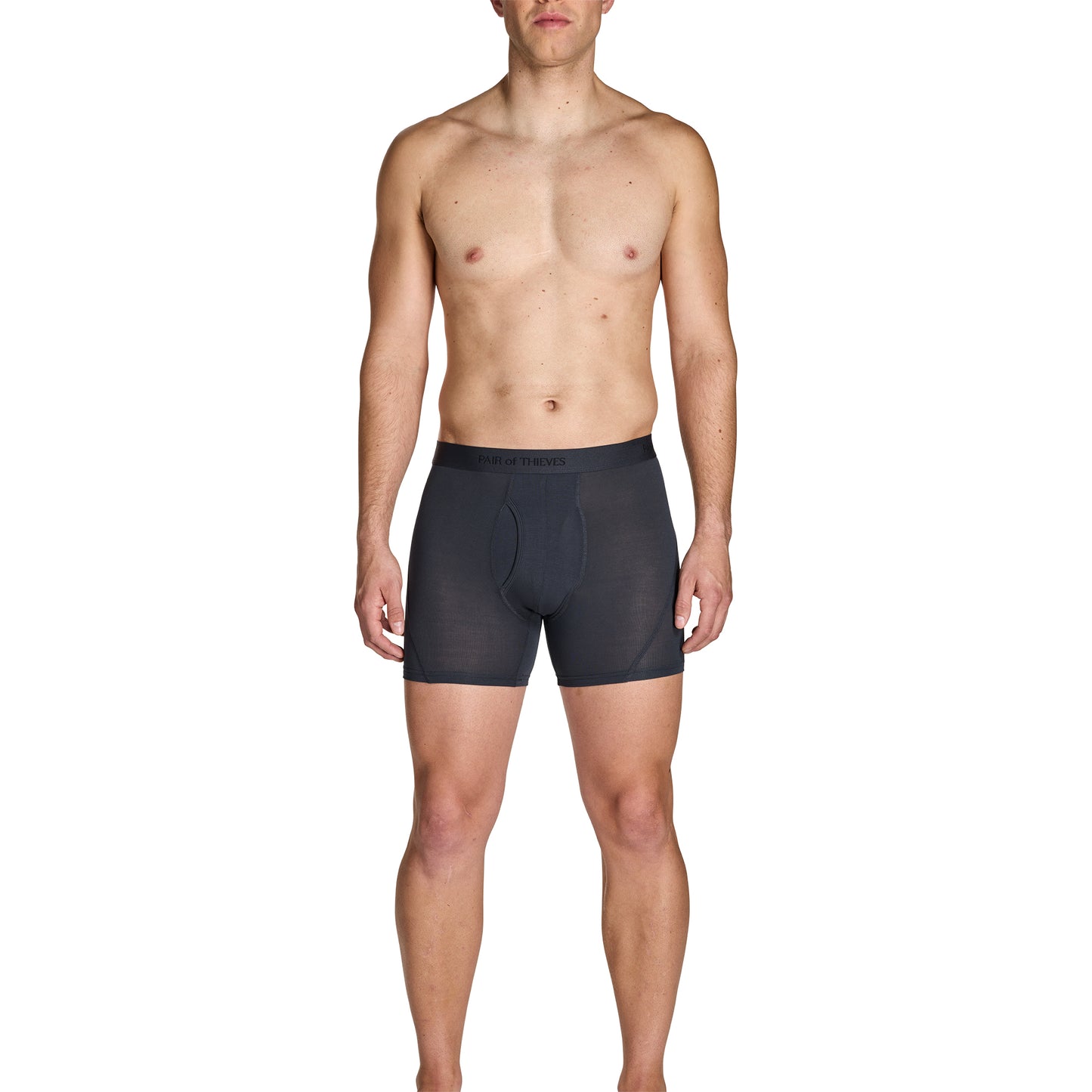 Man wearing black boxer briefs on a white background