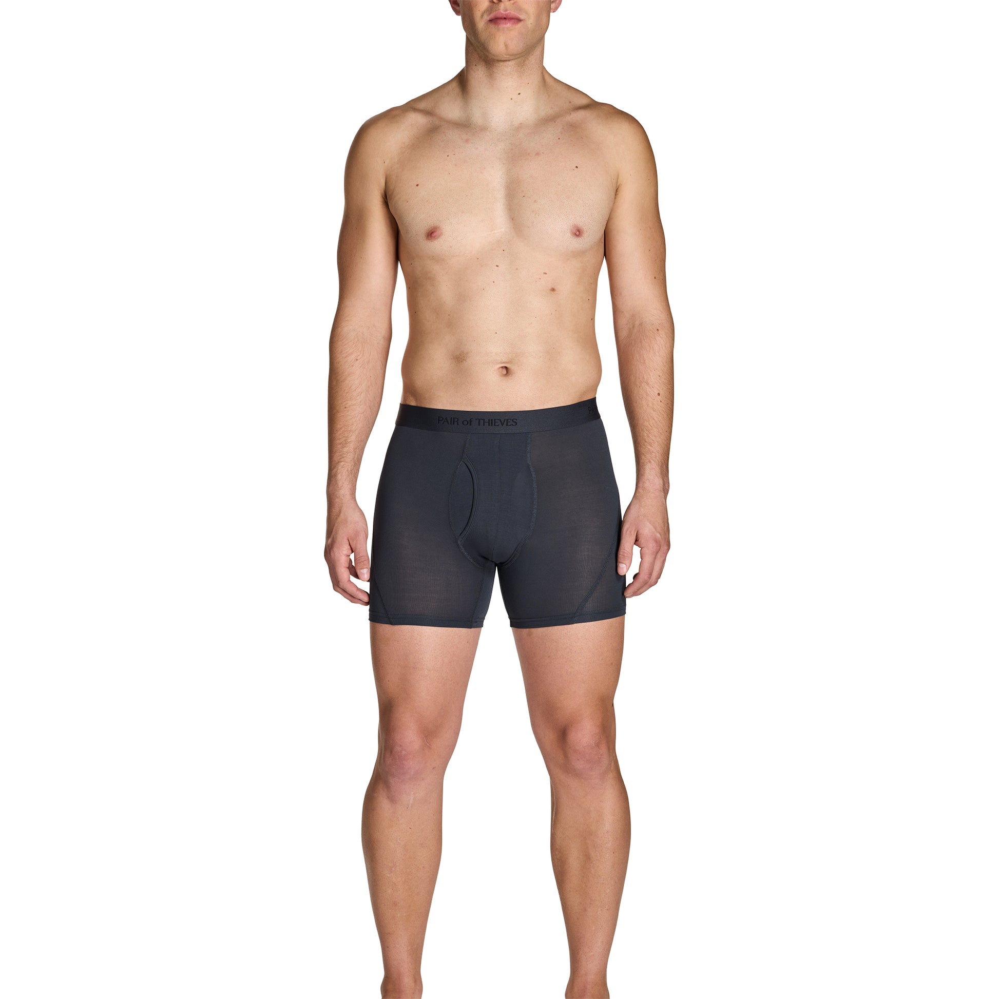 Man wearing black boxer briefs on a white background