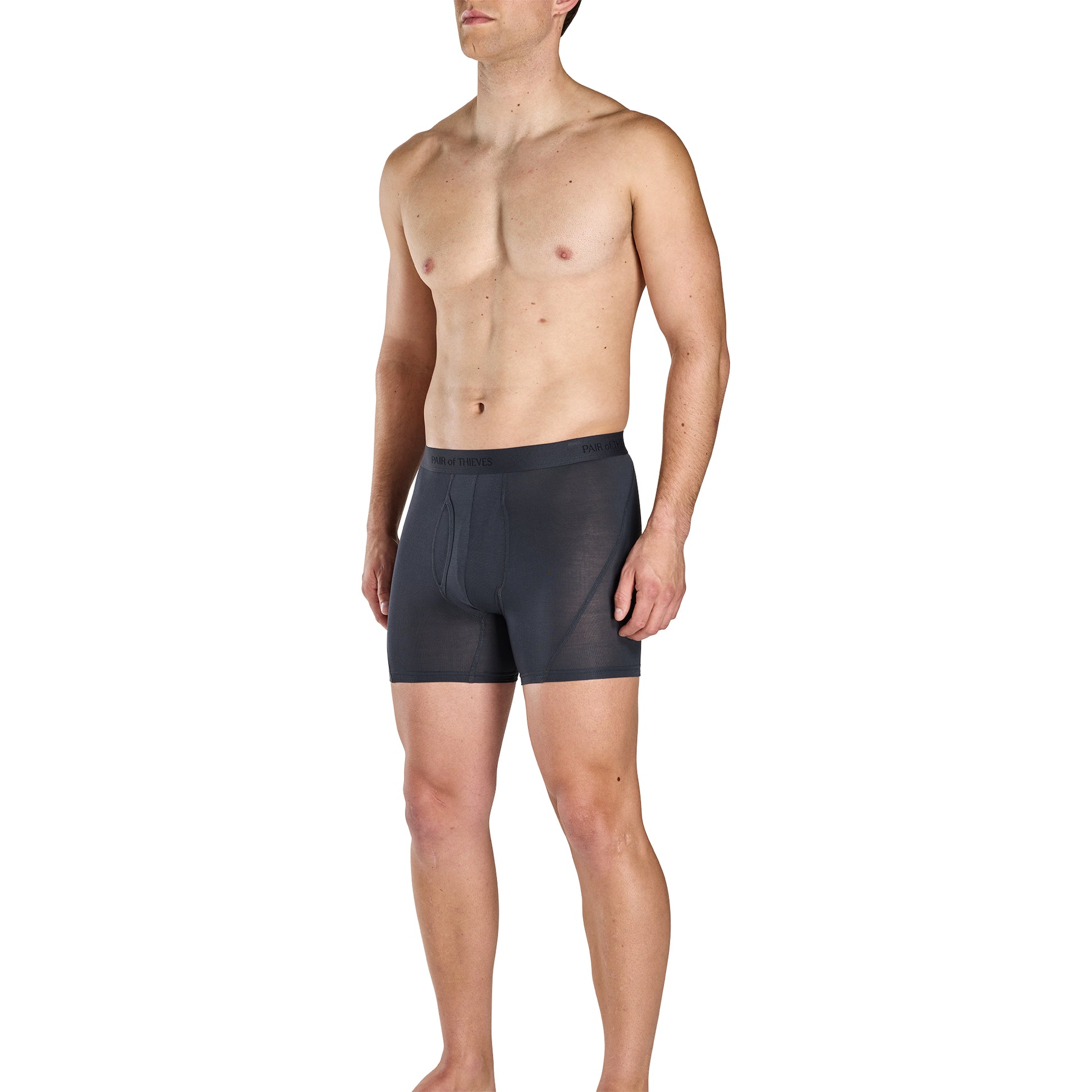Man wearing black swim shorts on a white background