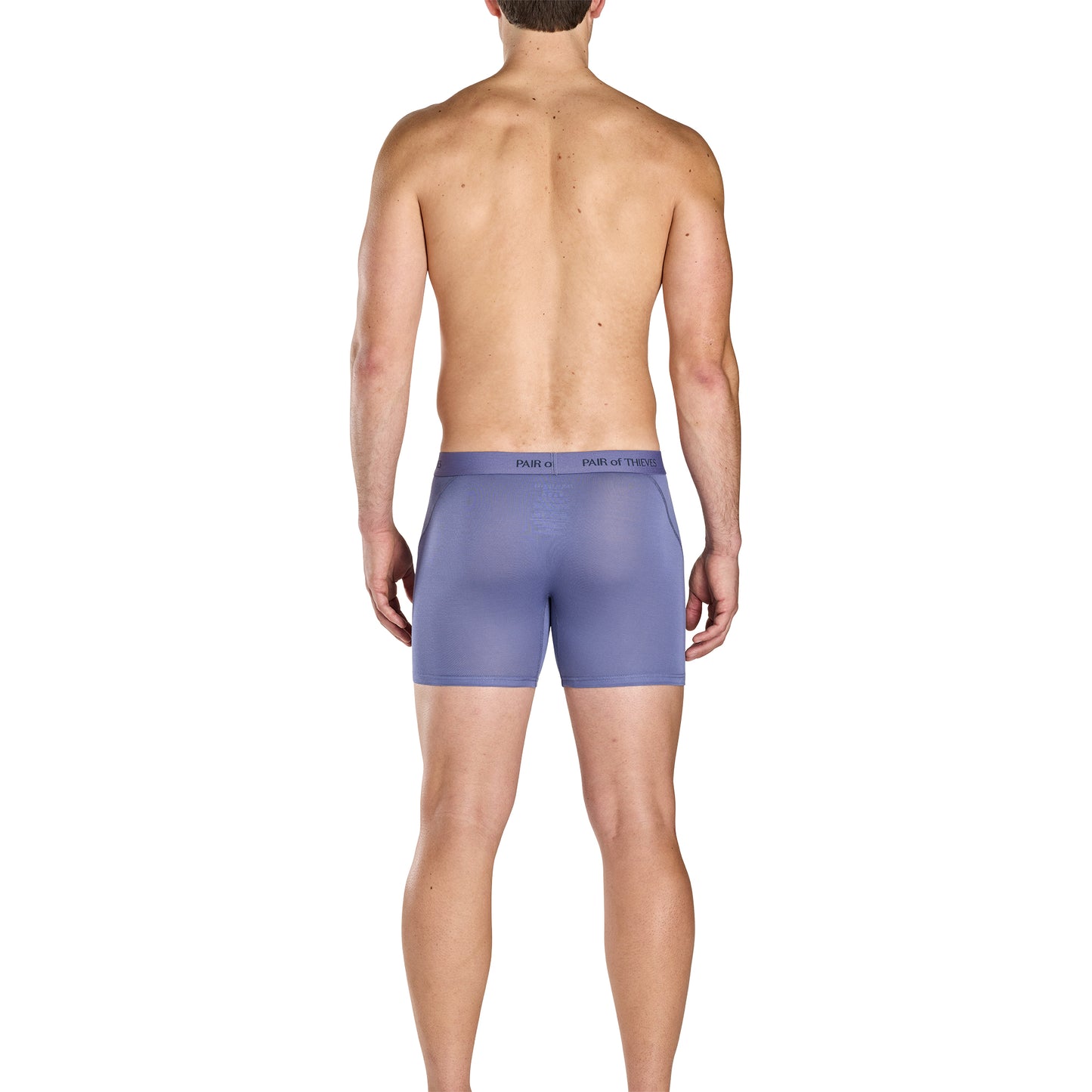 Man wearing purple boxer briefs on a white background