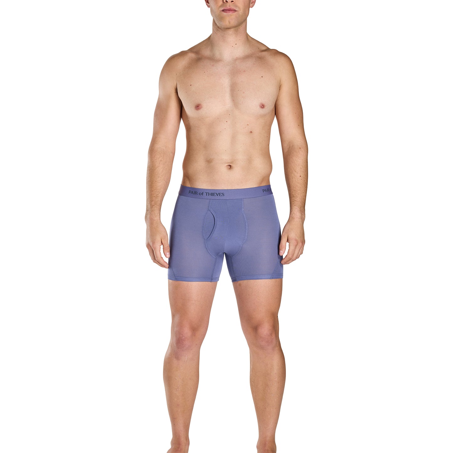 Man wearing a pair of purple boxer briefs on a white background