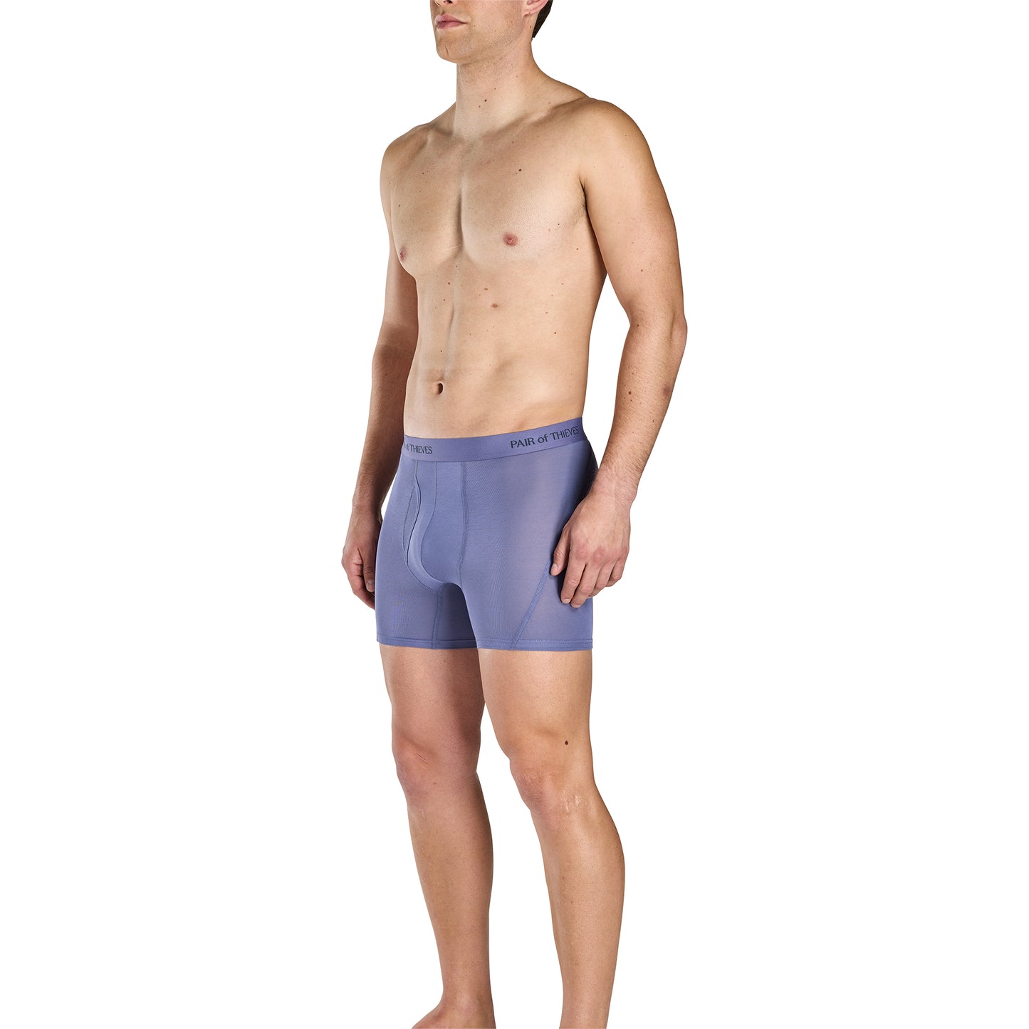 Man wearing a pair of purple boxer briefs on a white background