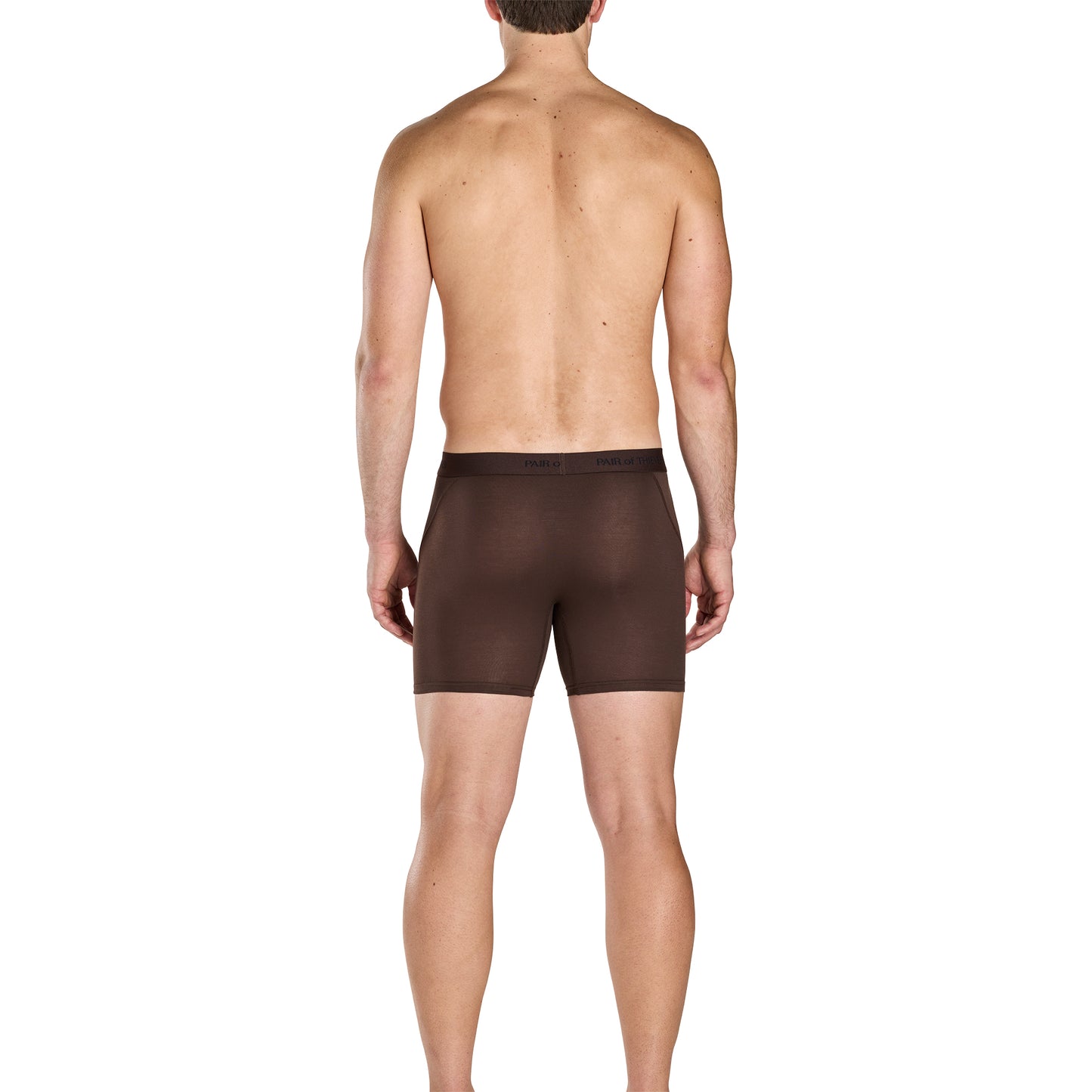 Man wearing brown boxer briefs on a white background