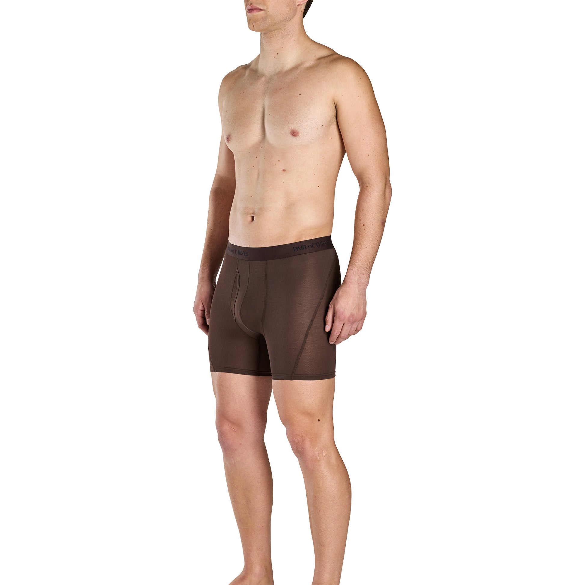 Man wearing brown boxer briefs on a white background