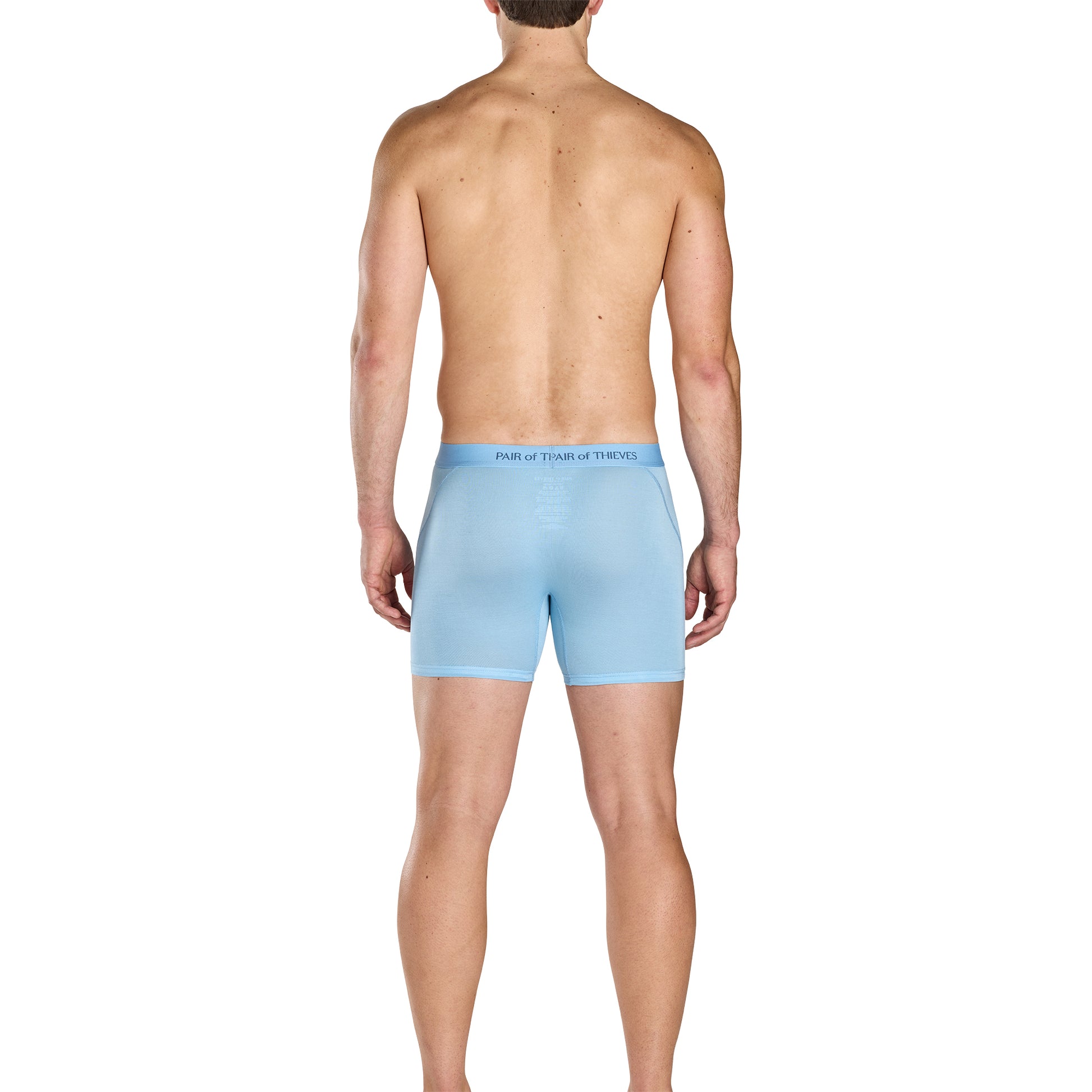 Man wearing light blue boxer briefs on a white background