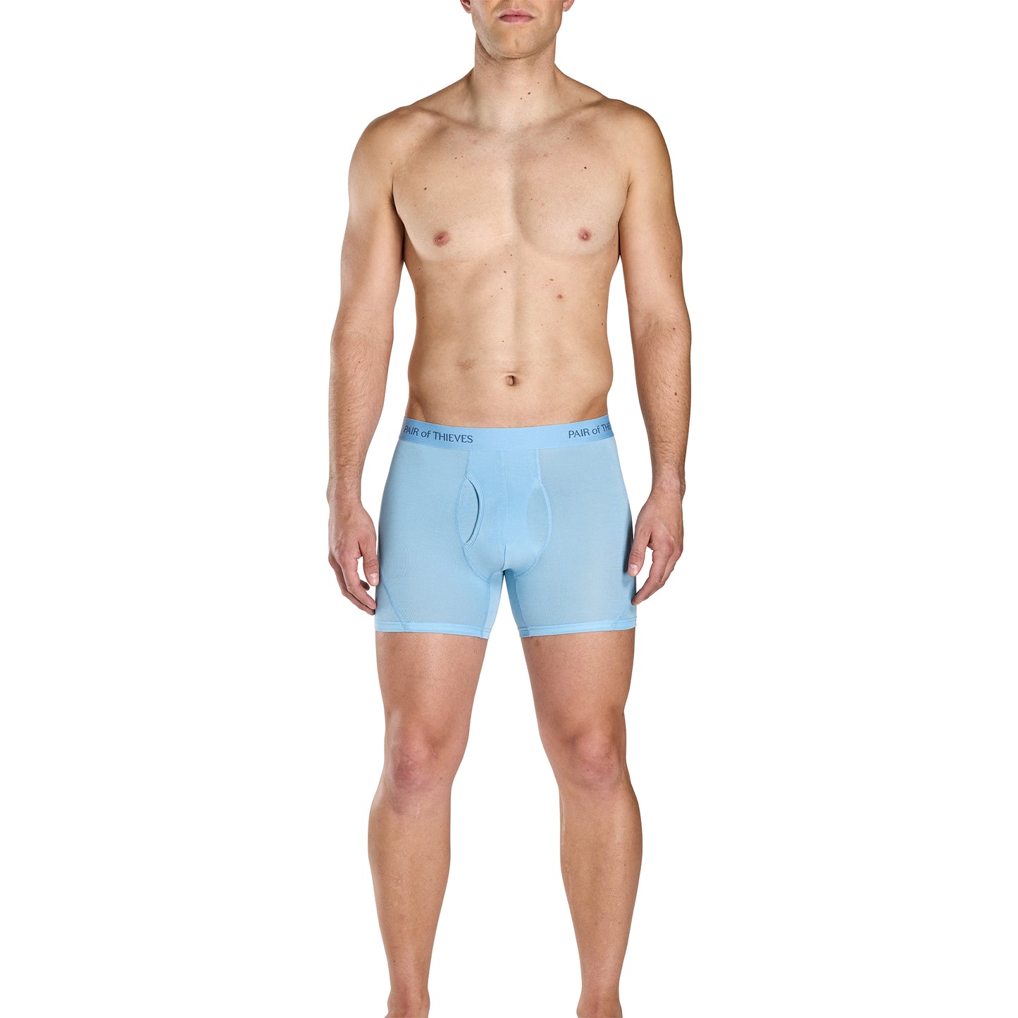 Man wearing light blue boxer briefs on a white background
