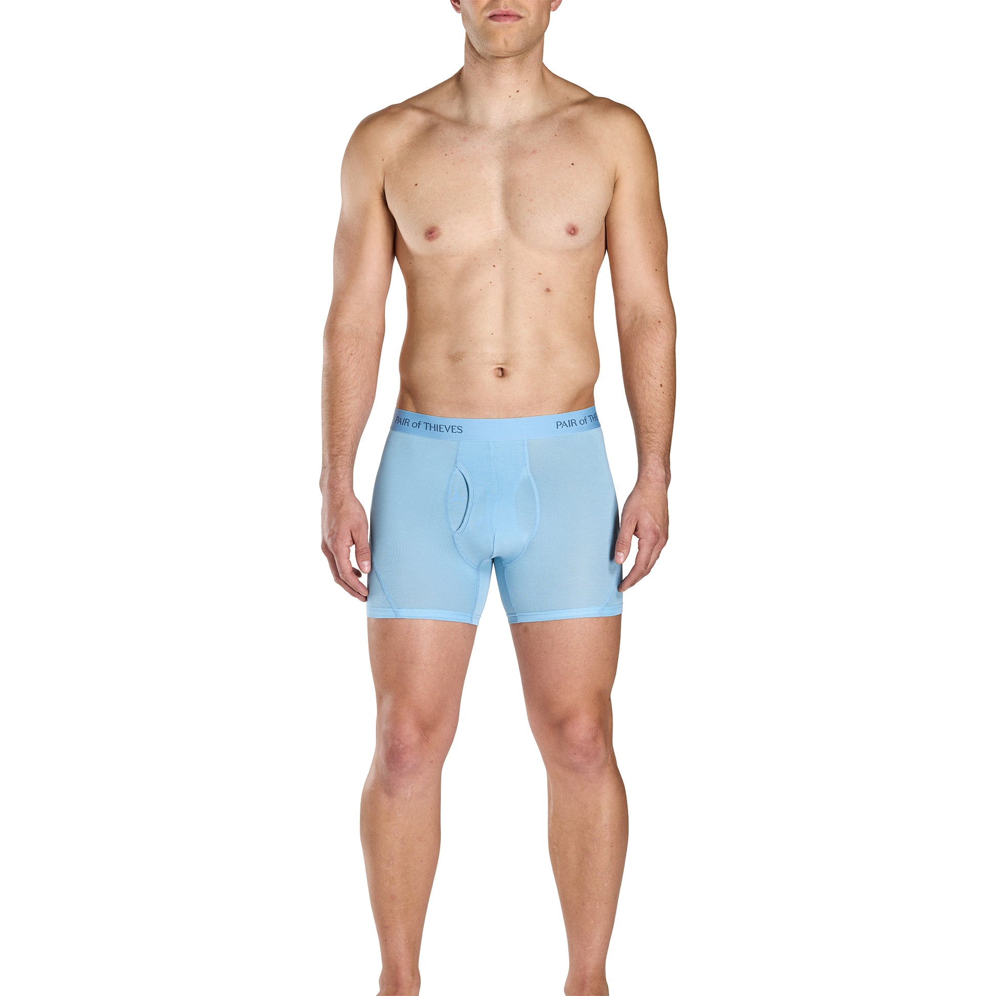Man wearing light blue boxer briefs on a white background