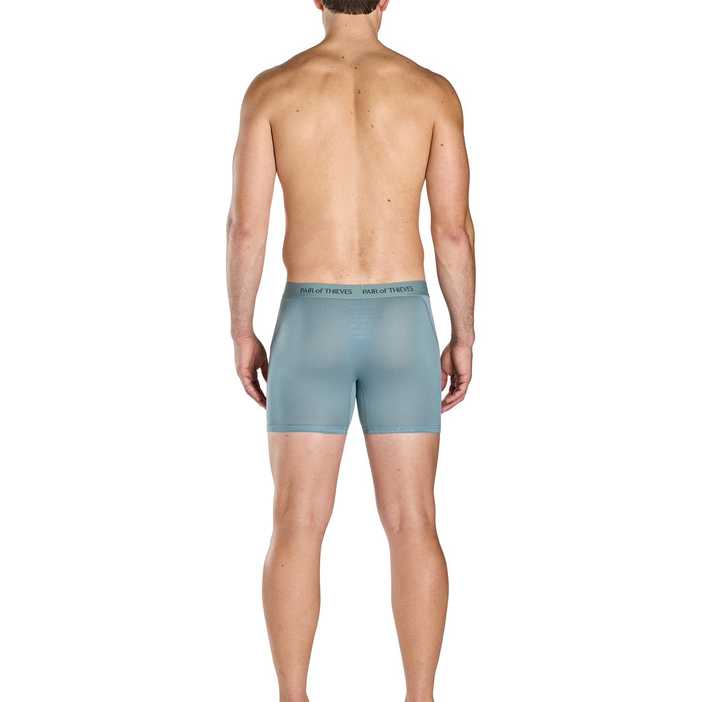 Man wearing light blue boxer briefs on a white background