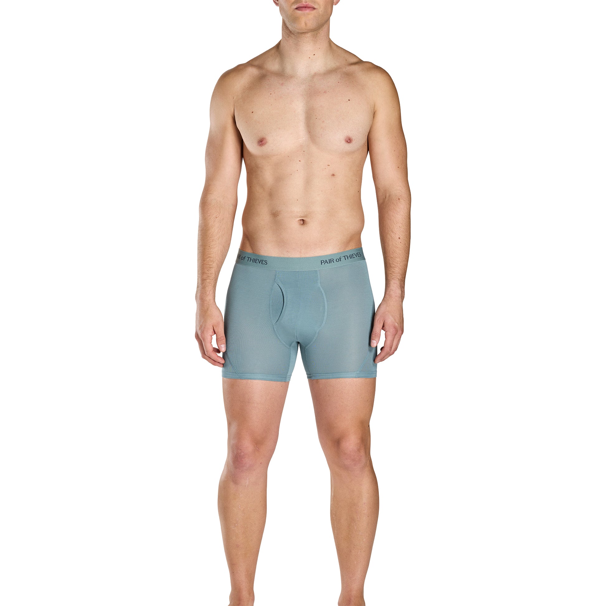 Man wearing light blue boxer briefs on a white background