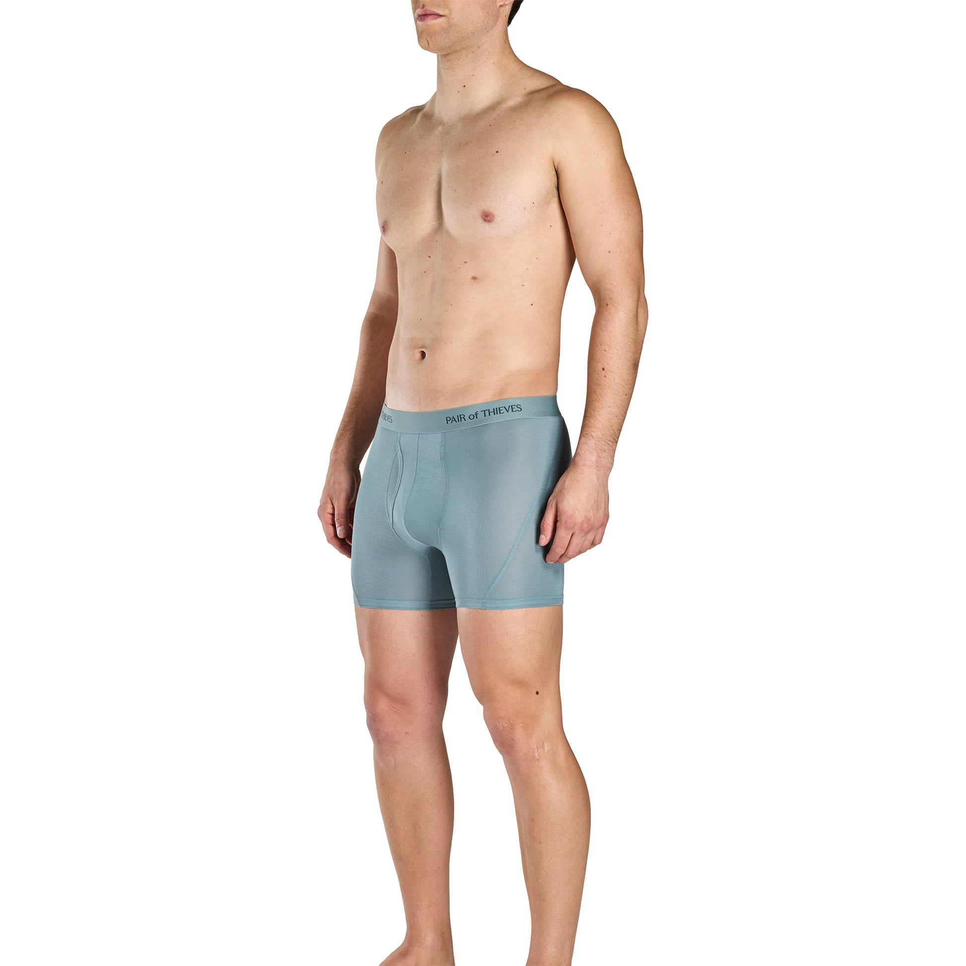 Man wearing light blue boxer briefs on a white background