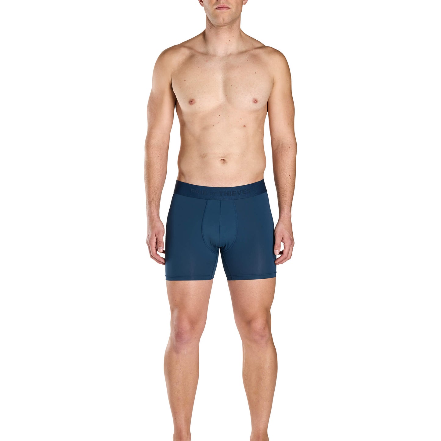 Man wearing blue SuperFit Pouch boxer briefs on a white background.